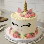 Elegant Unicorn Cake with Floral Decorations