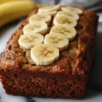 Moist banana bread with cottage cheese and fresh banana slices on top
