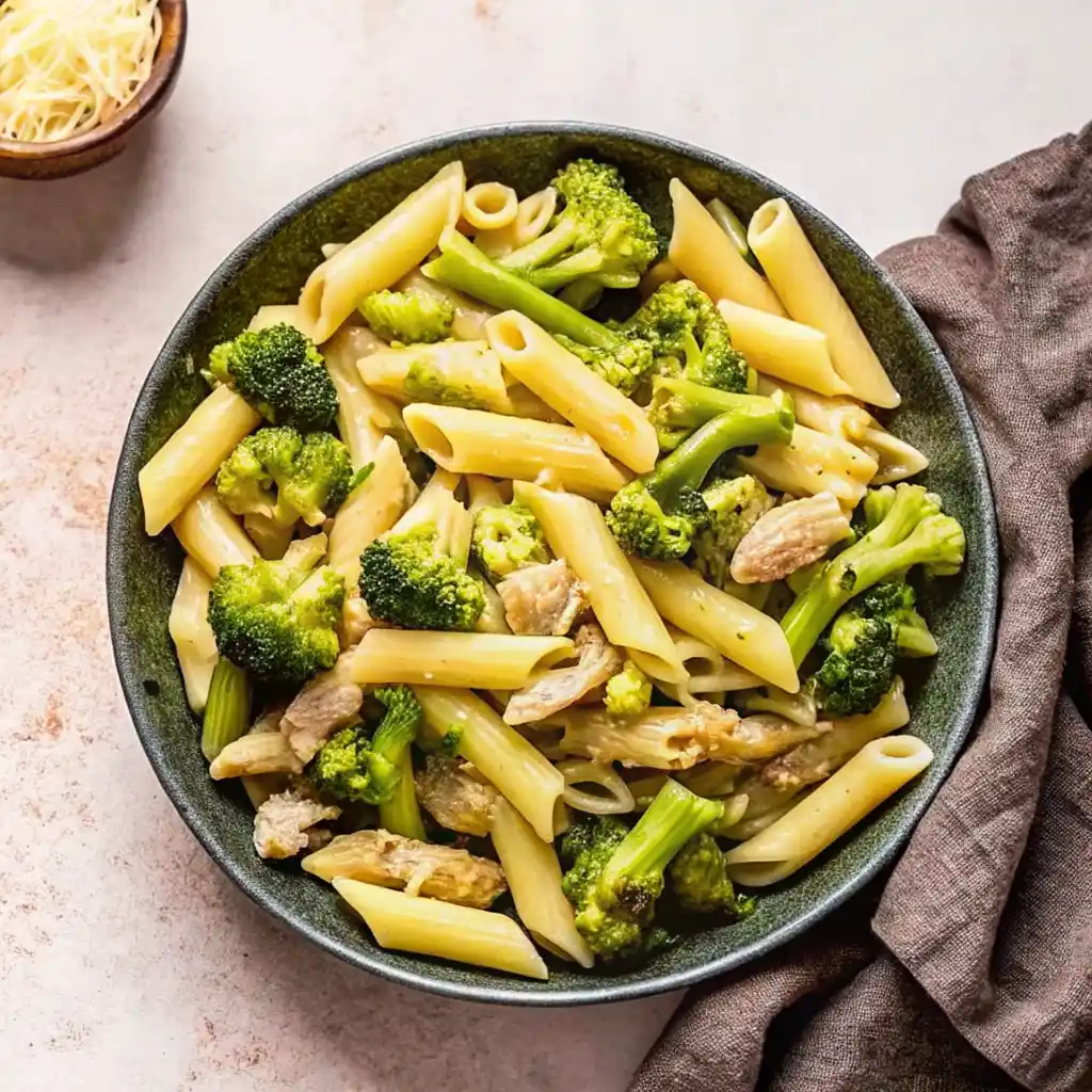 Penne pasta with chicken and broccoli in a creamy garlic sauce