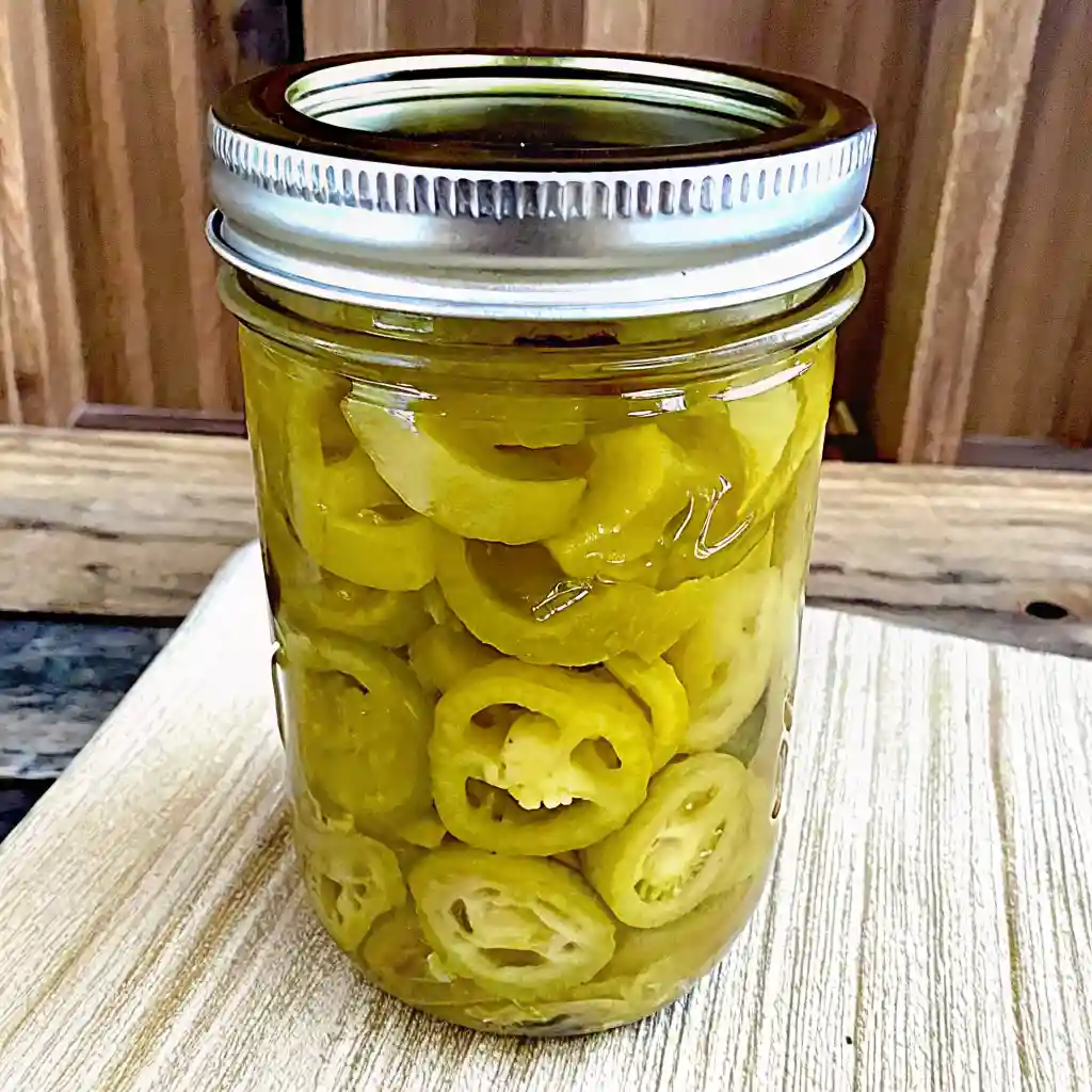 Jar filled with homemade pickled banana pepper rings